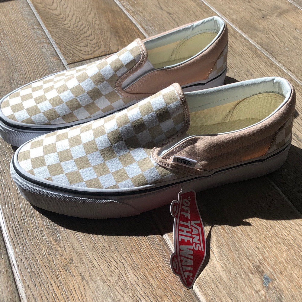 White slip on checkered tan vans